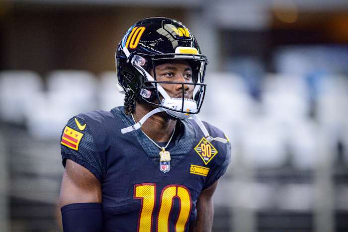 Receiver Curtis Samuel models the Washington Commanders black alternate uniforms. 